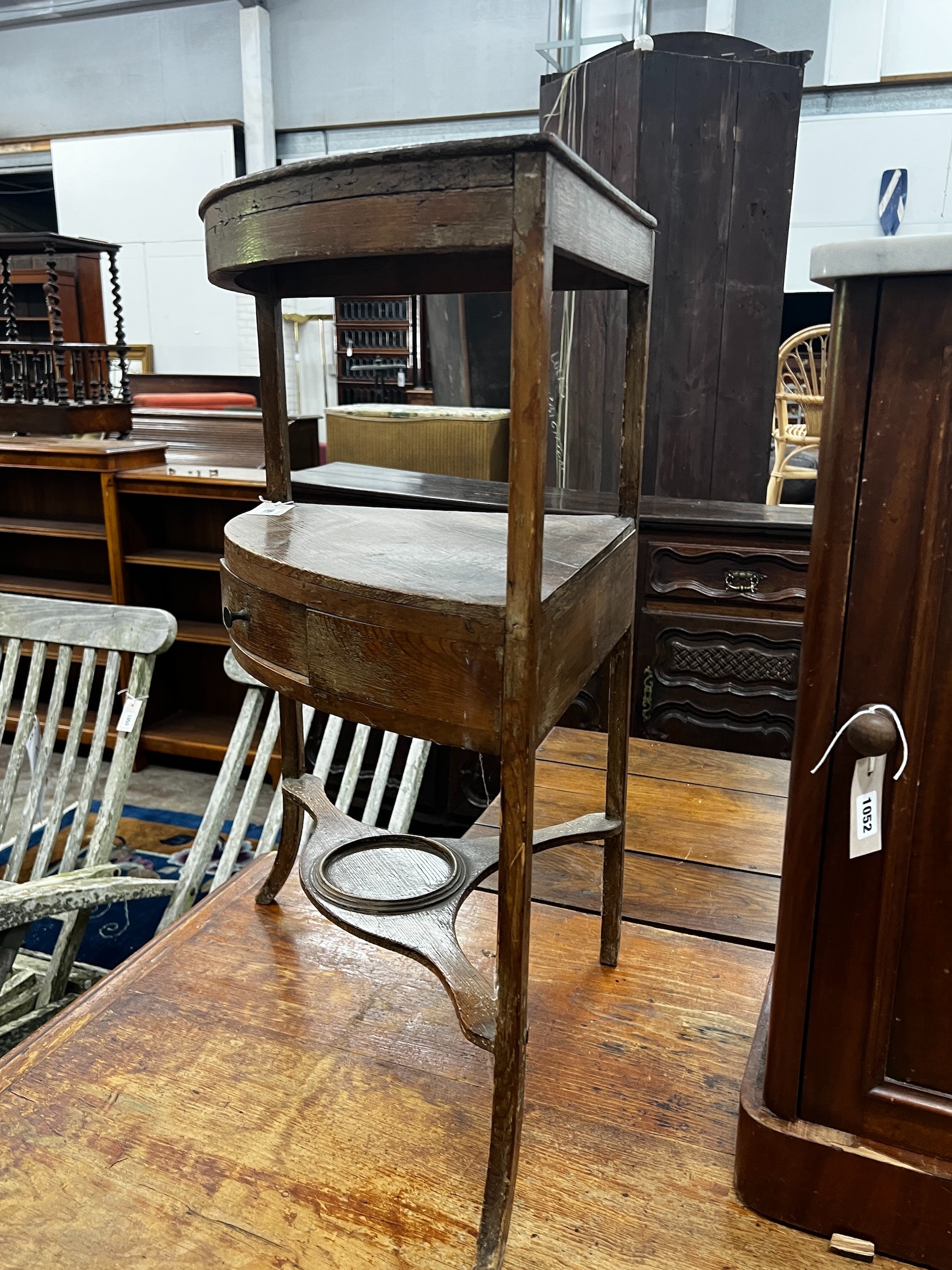 A George III pine bowfront three tier corner washstand, width 60cm depth 40cm height 80cm